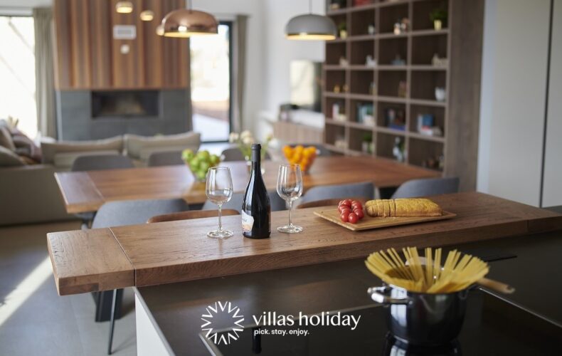 Kitchen island and dining area of Villa Ansi